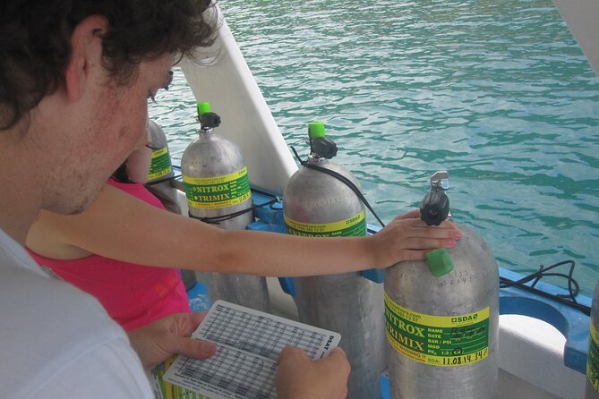 2 Tank Boat Dives for Certified Divers - Getting Fitted With the Included Equipment