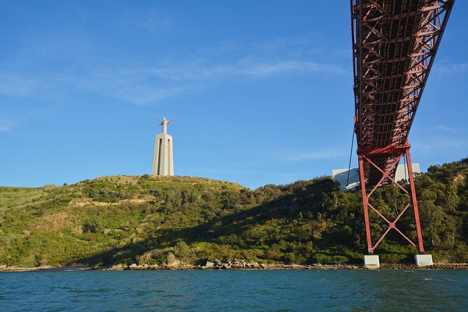 3 Hours Private Tour with Dives in Catamaran in Lisbon - Passing Belém Tower by catamaran