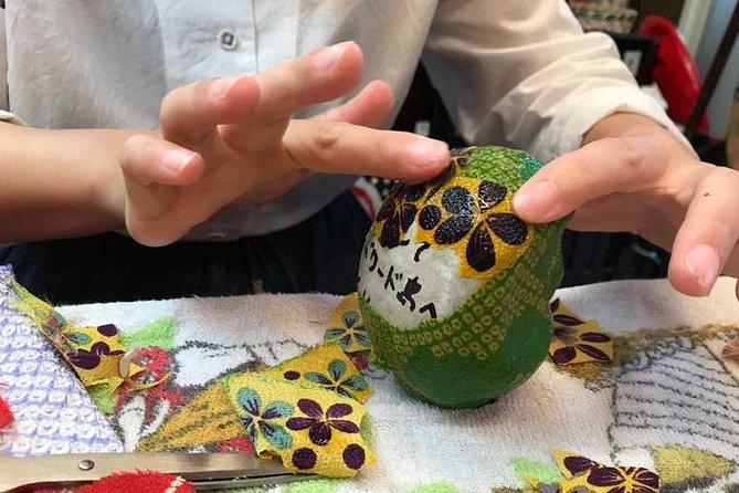 Deep Dive into the World of Daruma Dolls - Tea, Daruma games, and senbei while the glue dries