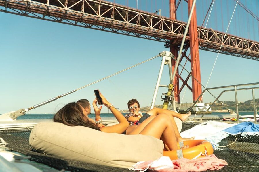 Lisbon: Catamaran Boat Party with Music, Open Bar & Dives - Algés and the open stretch of the Tagus