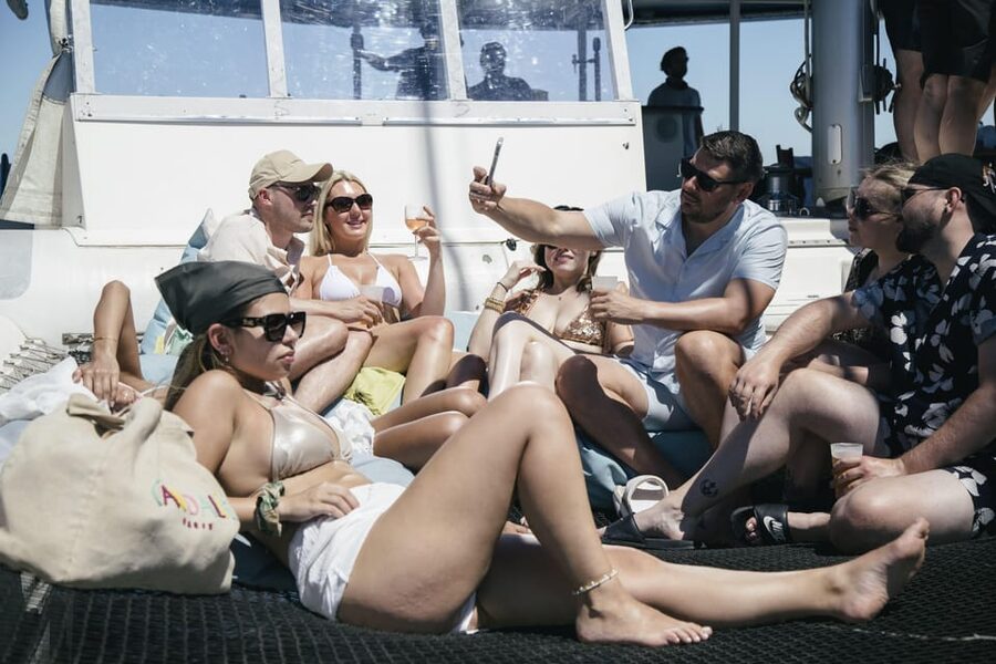 Lisbon: Catamaran Boat Party with Music, Open Bar & Dives - Belém Tower from the water