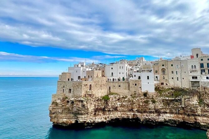 Polignano a Mare luxury boat tour, aperitif, diving and snorkeling - Following the coast and sea caves