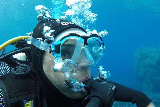 Scuba Diving Experience in Santorini - Entering the water and reaching the volcanic reef