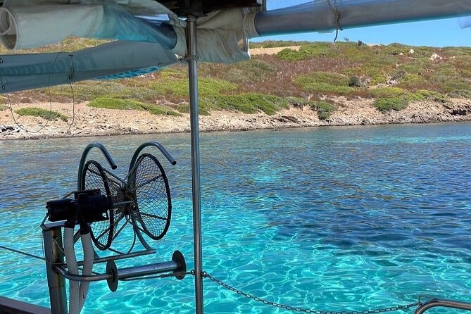 Snorkeling and Diving in the Gulf of Tavolara with Fishing - Tavolara’s cliffs and marina