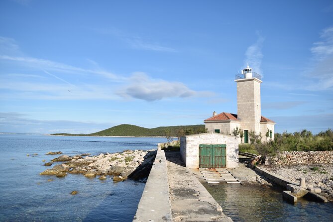 Zadar: Shipwreck Dive, Sandy Beach, Lighthouse & Island Tour - Mala Sestrica lighthouse is a quick photo stop